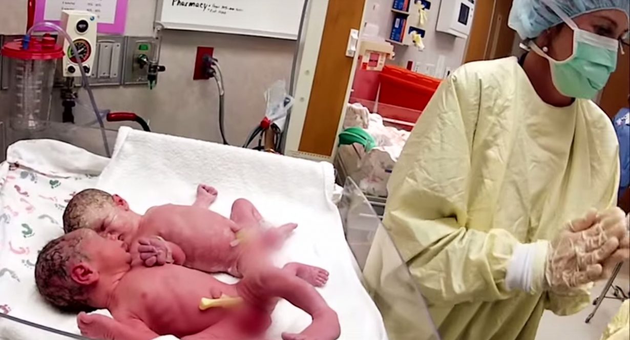 Nurse Places Newborn Twins In Same Crib And Something Shocking